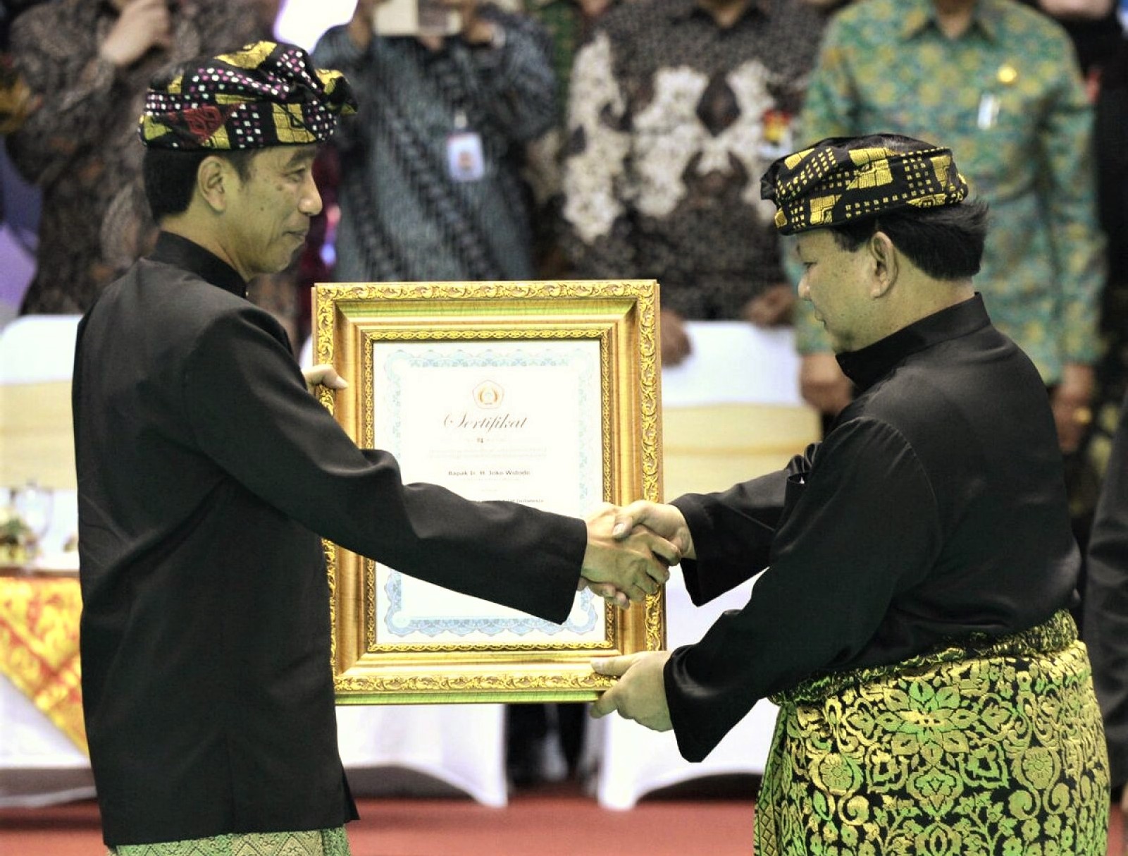  President Jokowi receiving Pendekar Honour from President of Persilat at Pencak Silat World Championships, Bali Indonesia 2016